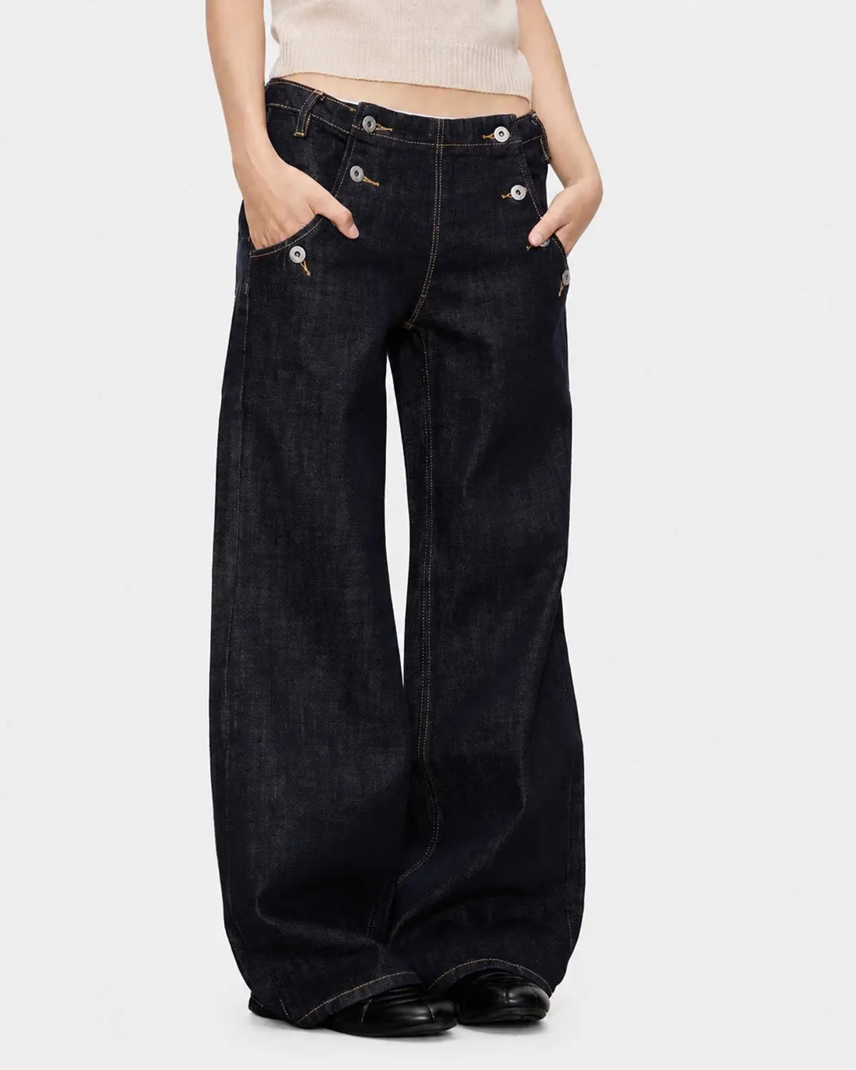 Black and blue wide-leg jeans with button details from Flation Streetwear, featuring raw hem and relaxed fit.