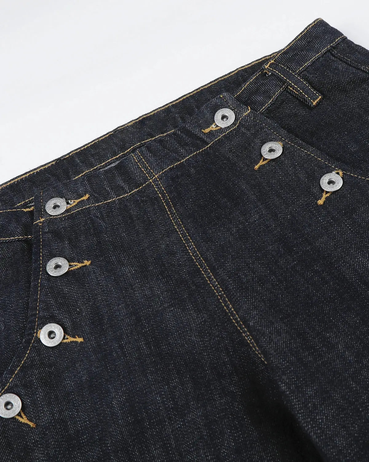 Black and blue raw wide-leg jeans with button details from Flation Streetwear, showcasing a relaxed fit and modern style.