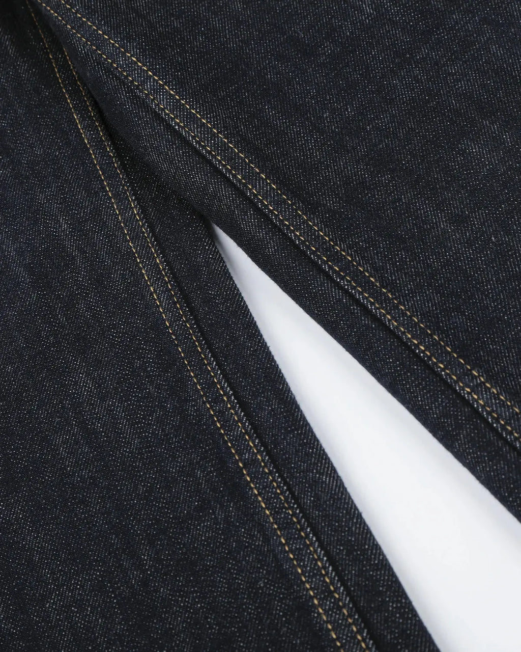 Black and blue button-detail raw wide-leg jeans by Flation Streetwear, featuring a relaxed fit and stylish design.
