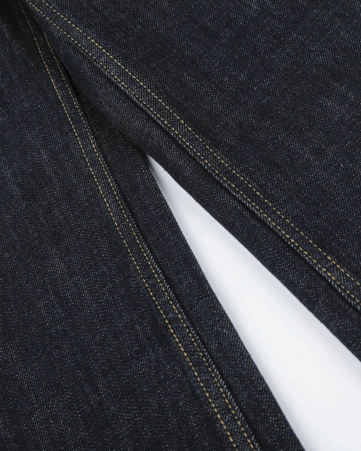 Black and blue button-detail raw wide-leg jeans by Flation Streetwear, featuring a relaxed fit and stylish design.