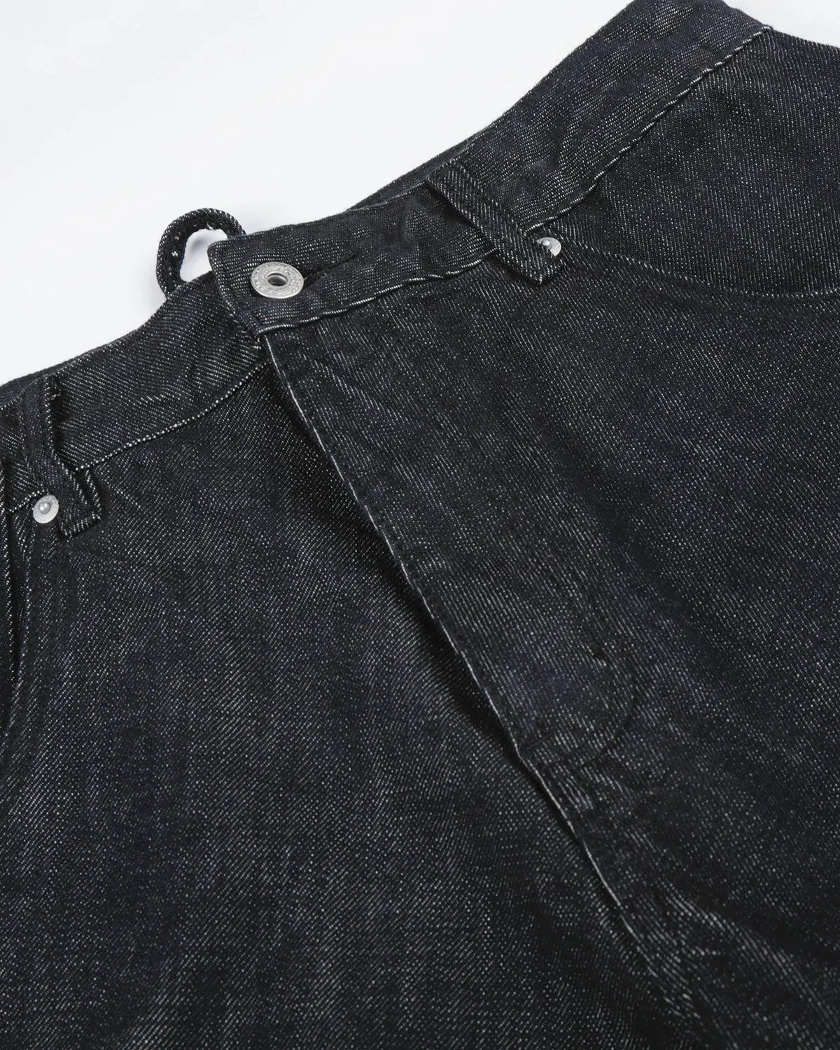Black and blue Cinch Back Raw Baggy Jeans by Flation Streetwear with relaxed fit and visible stitching, styled for casual streetwear.
