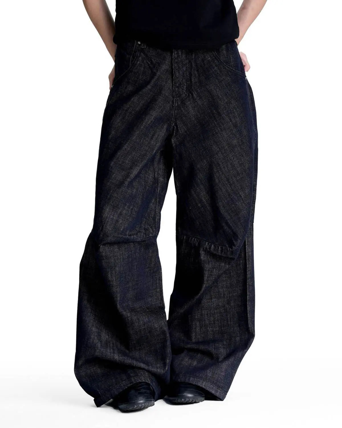 Black and blue Cinch Back Raw Baggy Jeans by Flation Streetwear, featuring a relaxed fit and raw hem details.