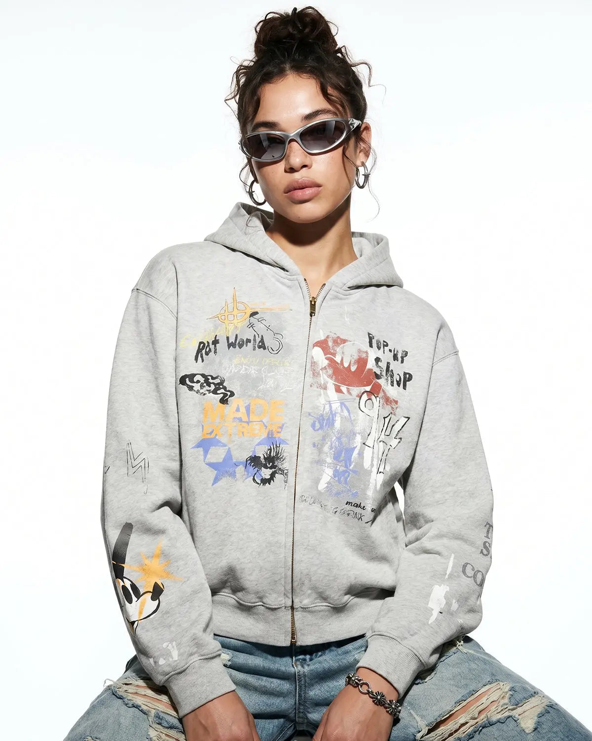 Black boxy graffiti zip-up hoodie by Flation Streetwear, featuring bold graffiti designs and a relaxed fit.