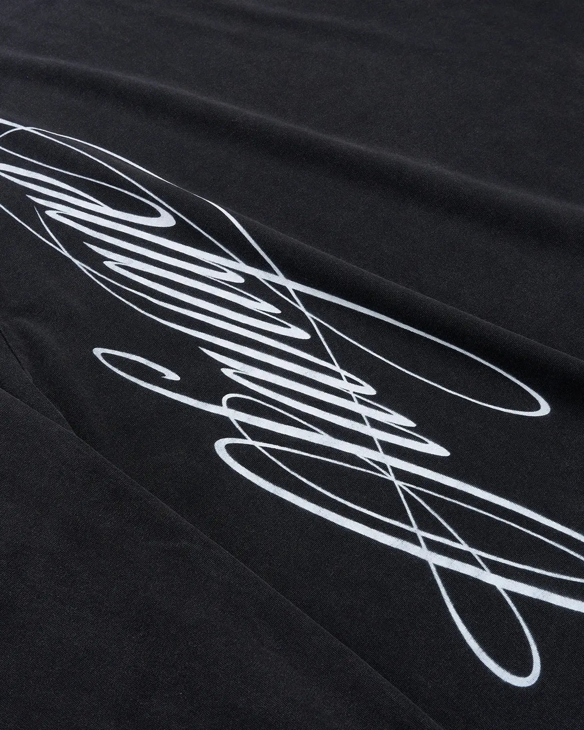 Black boxy fit graphic washed T-shirt by Flation Streetwear featuring bold script design on the front.