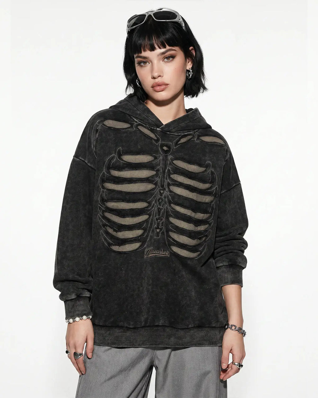 Black distressed ribcage wash hoodie by Flation Streetwear, featuring a relaxed fit and edgy design with graphic detailing.