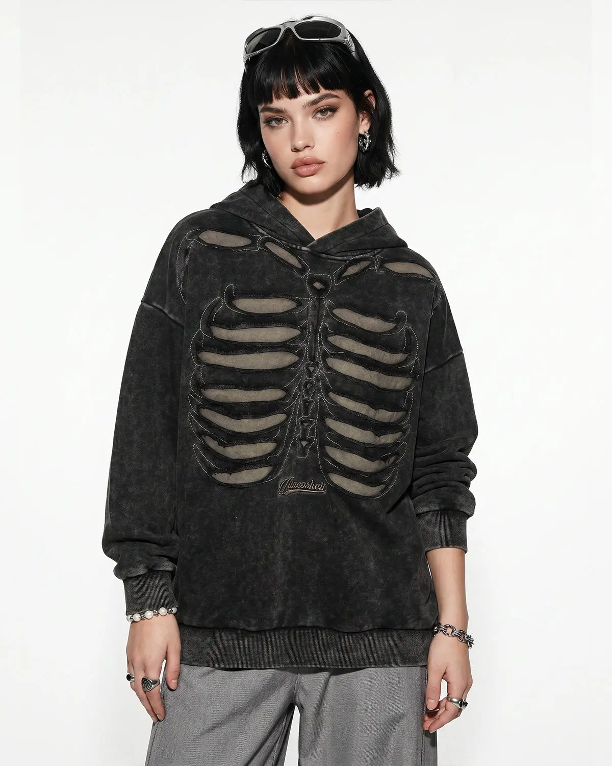 Black distressed ribcage wash hoodie by Flation Streetwear, featuring a relaxed fit and edgy design with graphic detailing.