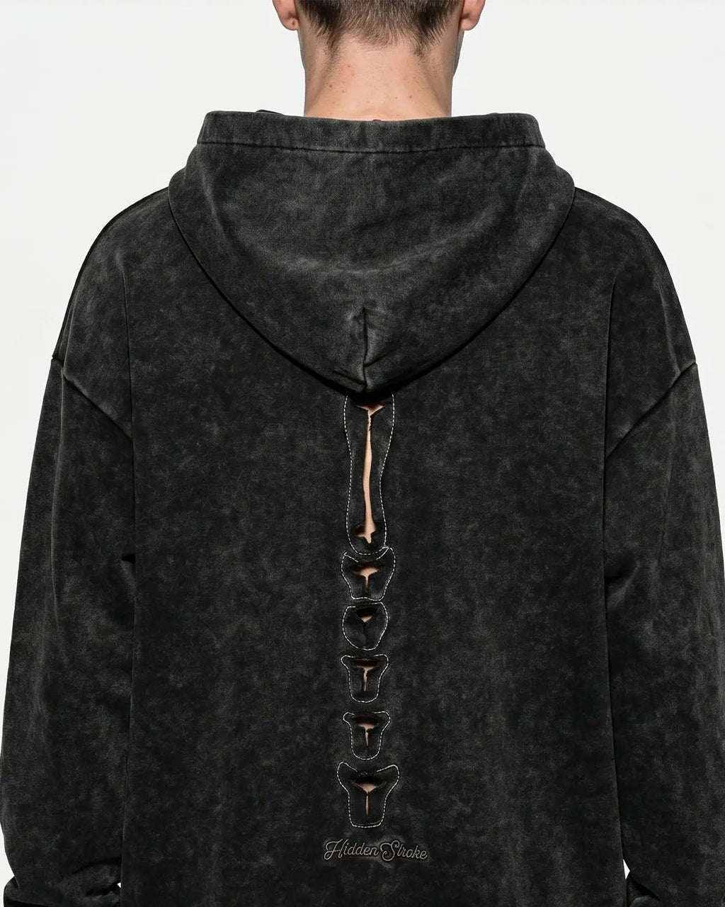 Black distressed ribcage wash hoodie by Flation Streetwear with a relaxed fit and edgy design, showcasing the unique washed finish.