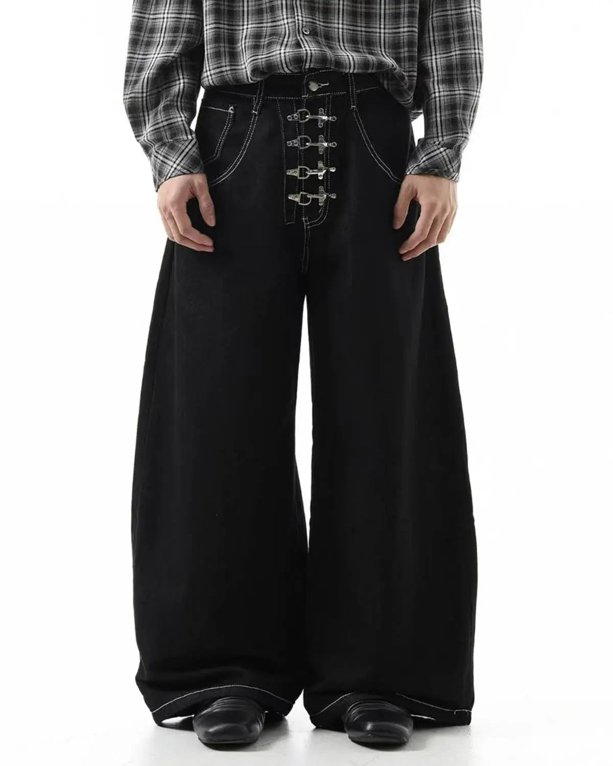 Raw metal clasp baggy jeans by Flation Streetwear featuring a relaxed fit and distressed denim with metal button details.