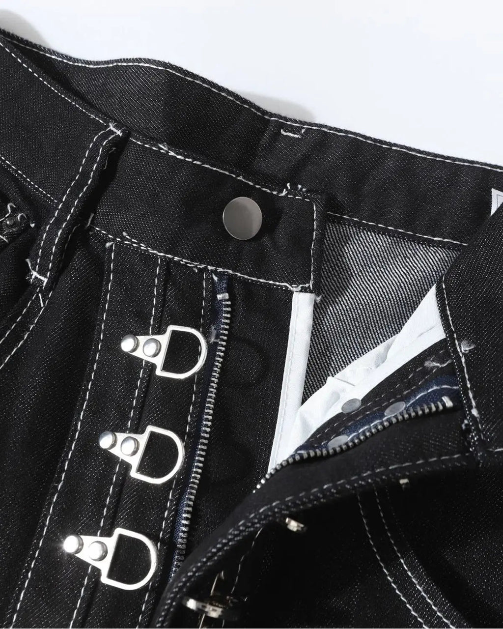 Raw metal clasp baggy jeans from Flation Streetwear featuring a relaxed fit and distressed denim style.