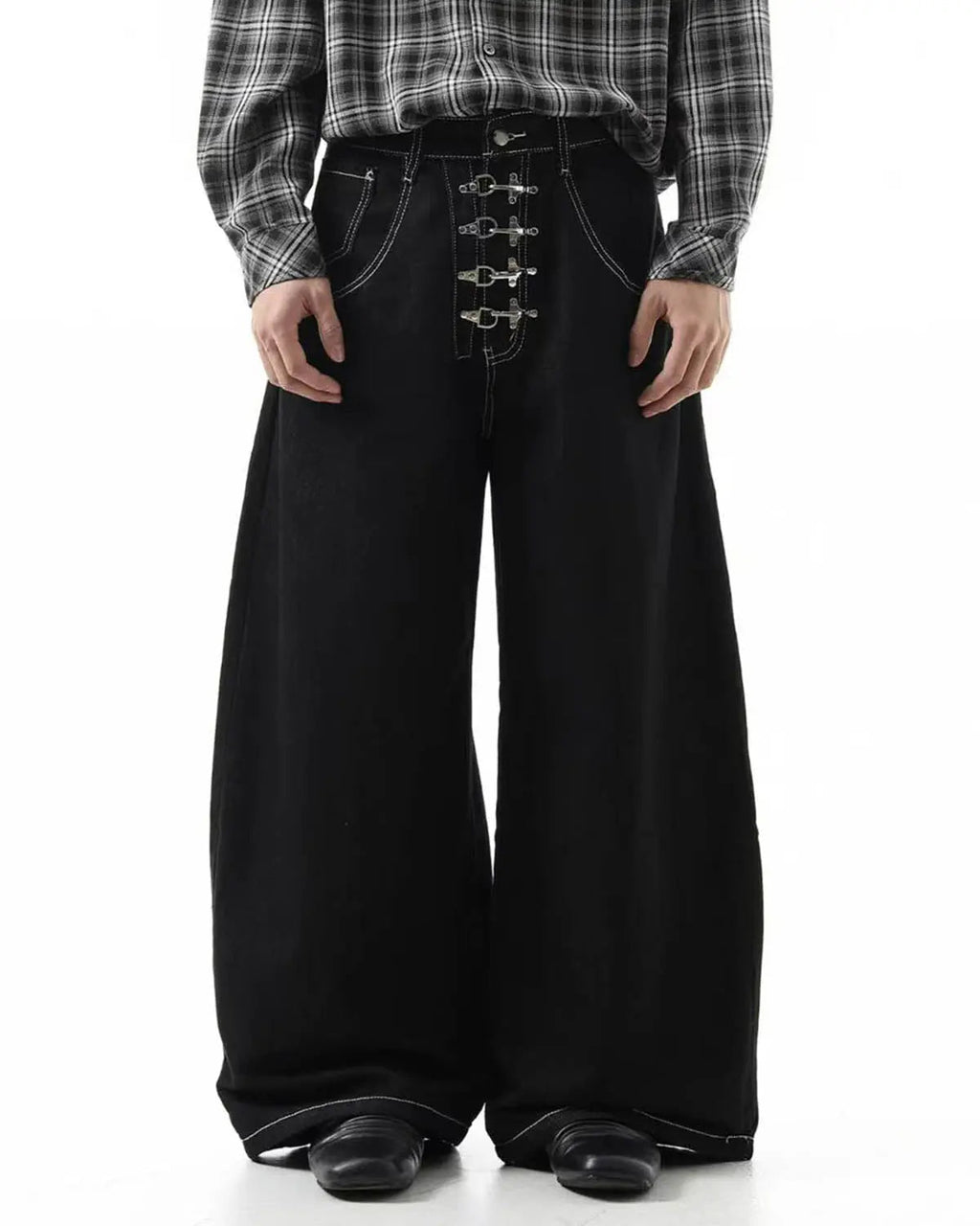Raw metal clasp baggy jeans by Flation Streetwear, featuring a relaxed fit and distressed denim with prominent metal clasp details.