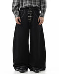 Raw metal clasp baggy jeans by Flation Streetwear, featuring a relaxed fit and distressed denim with prominent metal clasp details.