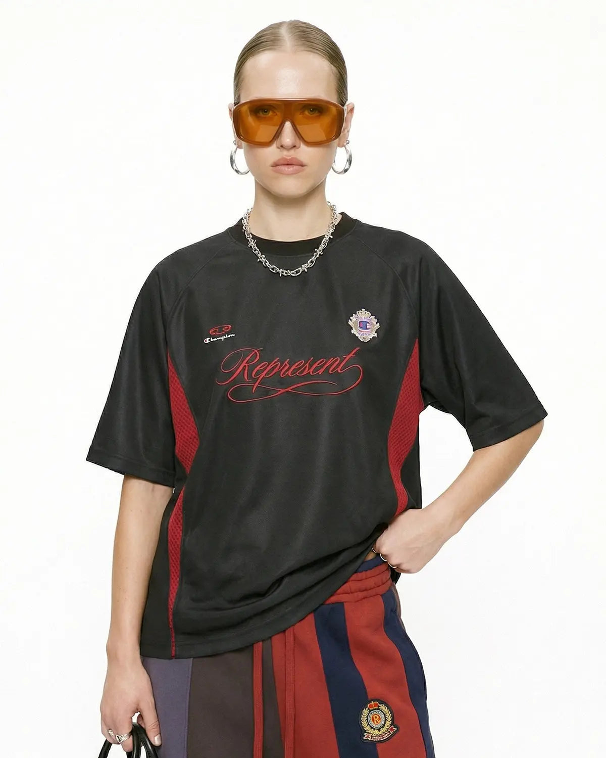 Retro colorblock football jersey by Flation featuring bold red, navy, and white panels, classic sports style and vintage-inspired design.