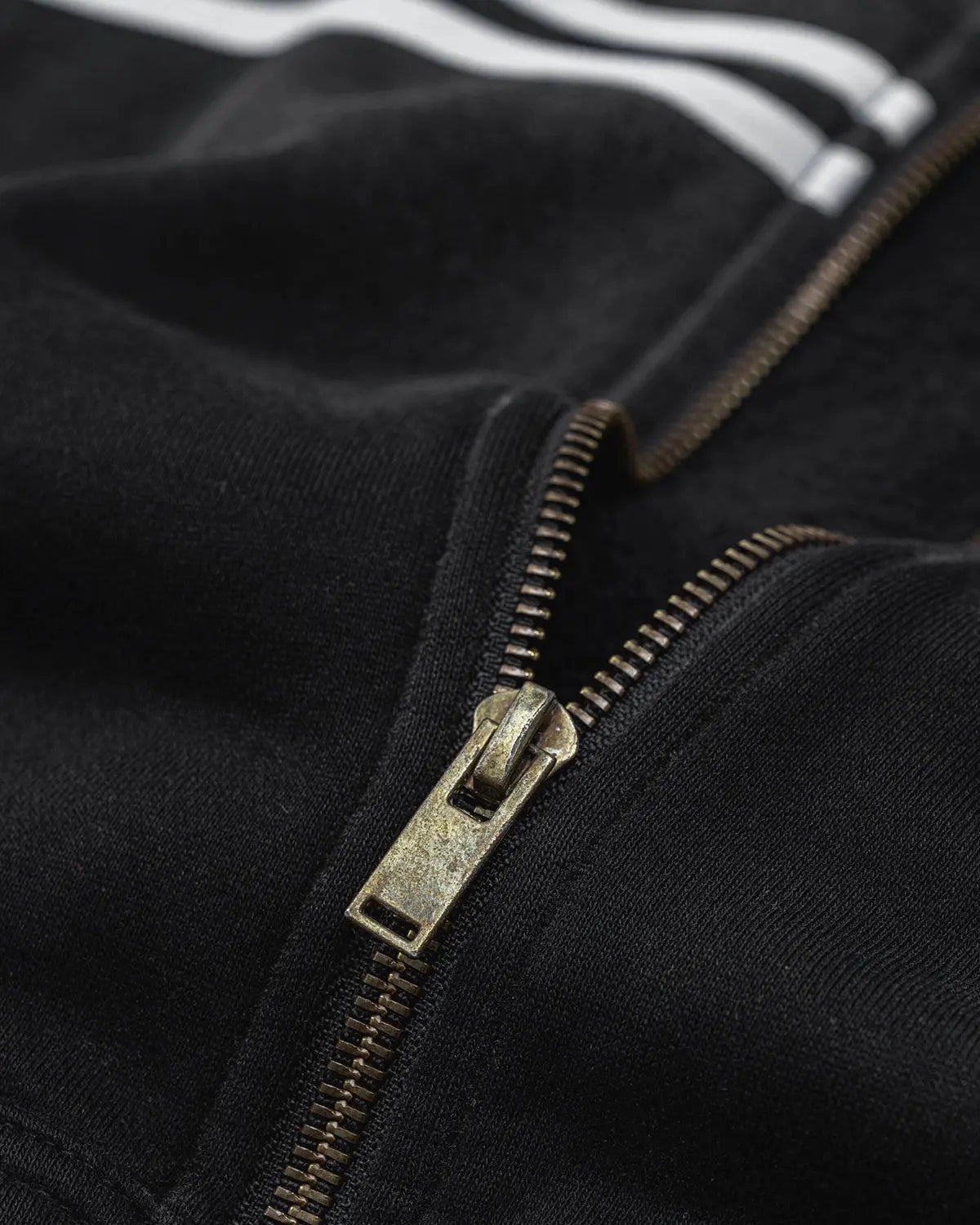 Black striped acid wash zip-up hoodie by Flation Streetwear showing front view with hood and zipper detail.