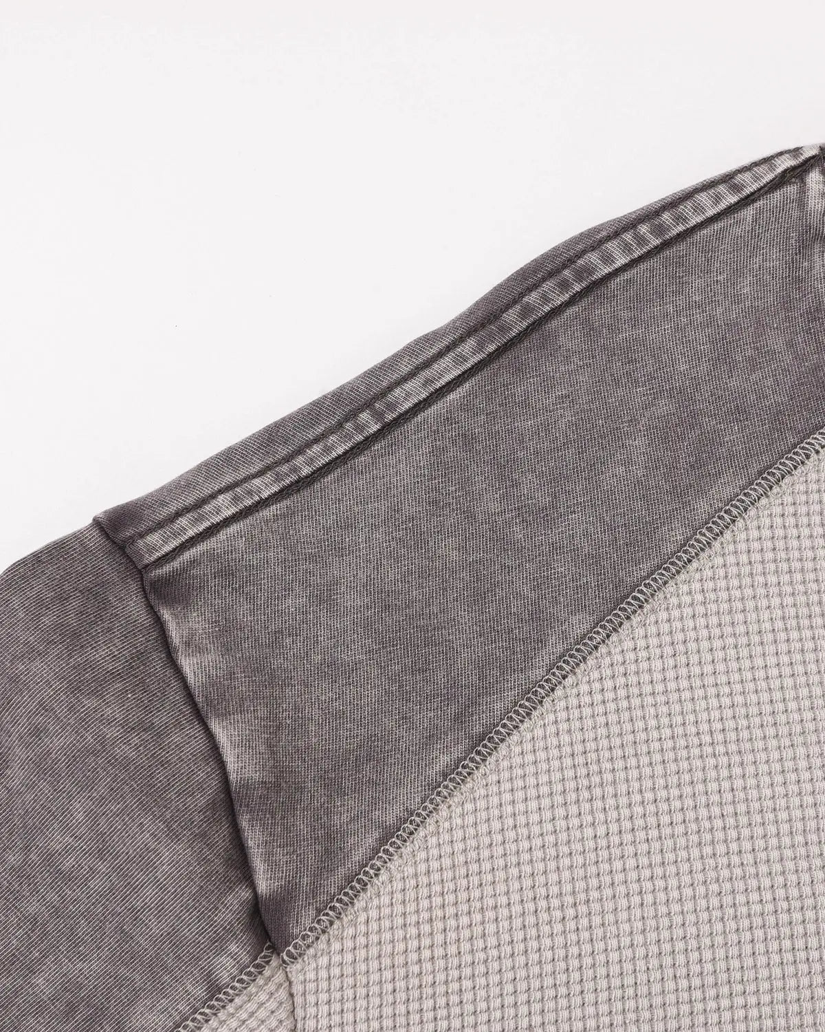 Black textured patchwork washed T-shirt by Flation Streetwear, showing the detailed fabric design and casual fit.