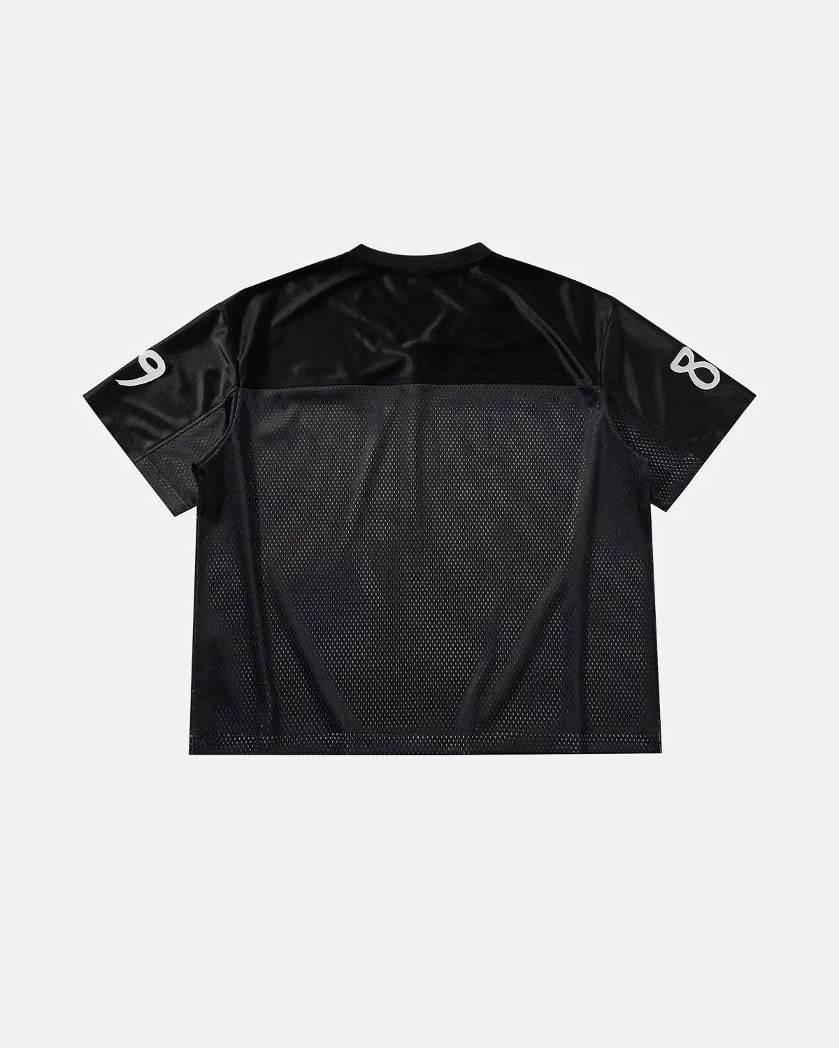 Black V-neck mesh patchwork jersey tee from Flation Streetwear, showcasing a stylish, breathable design with layered fabric patches.