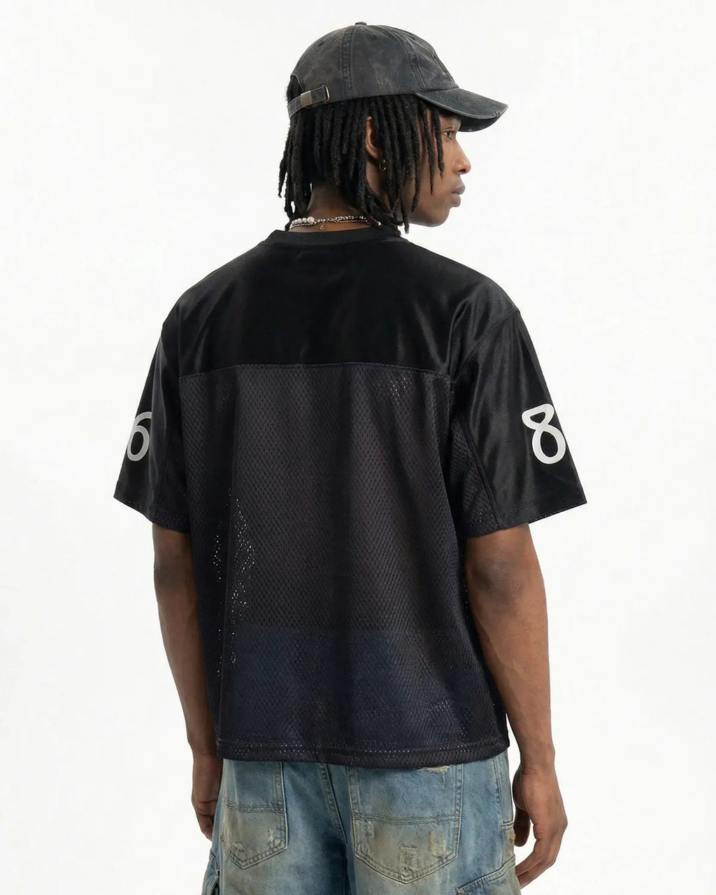 Black V-neck mesh patchwork jersey tee by Flation Streetwear, featuring a stylish patchwork design and comfortable fit.