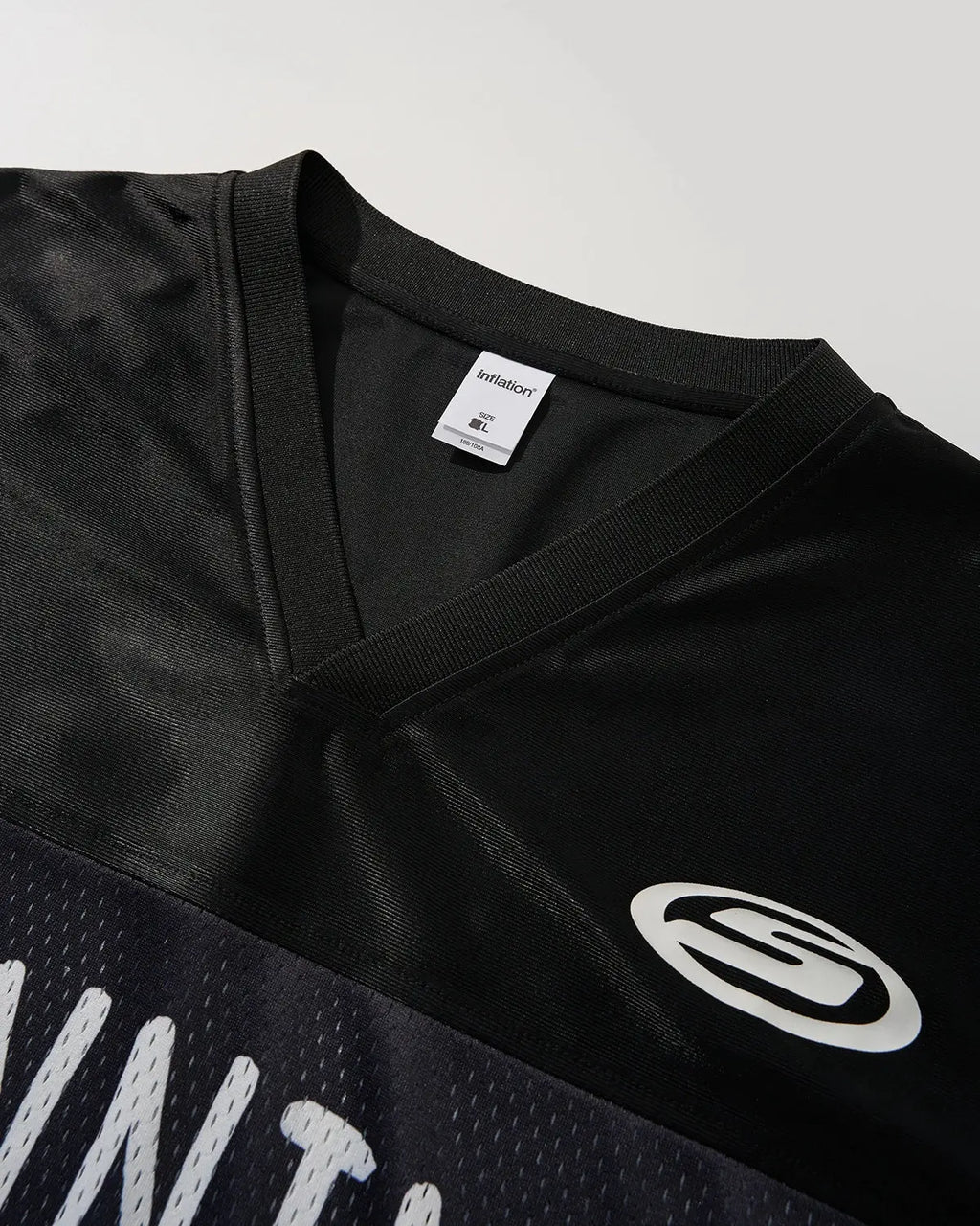 Black V-neck mesh patchwork jersey tee by Flation Streetwear, showcasing a stylish mesh and patchwork design.