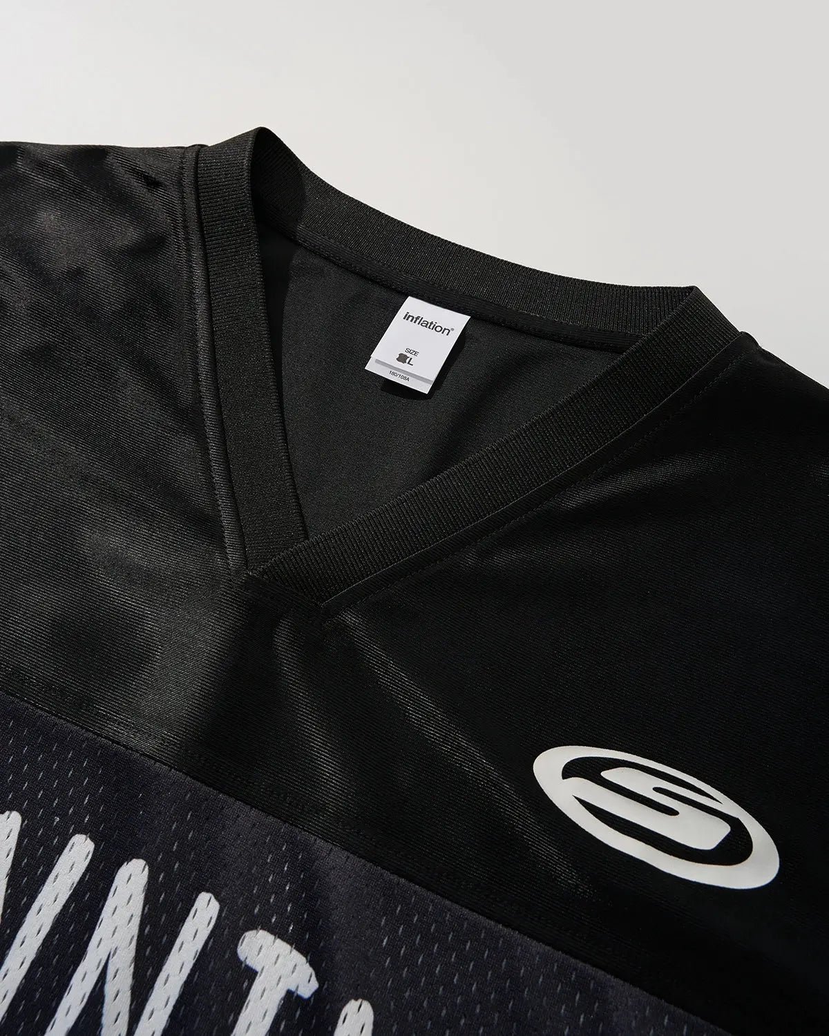 Black V-neck mesh patchwork jersey tee by Flation Streetwear, showcasing a stylish mesh and patchwork design.