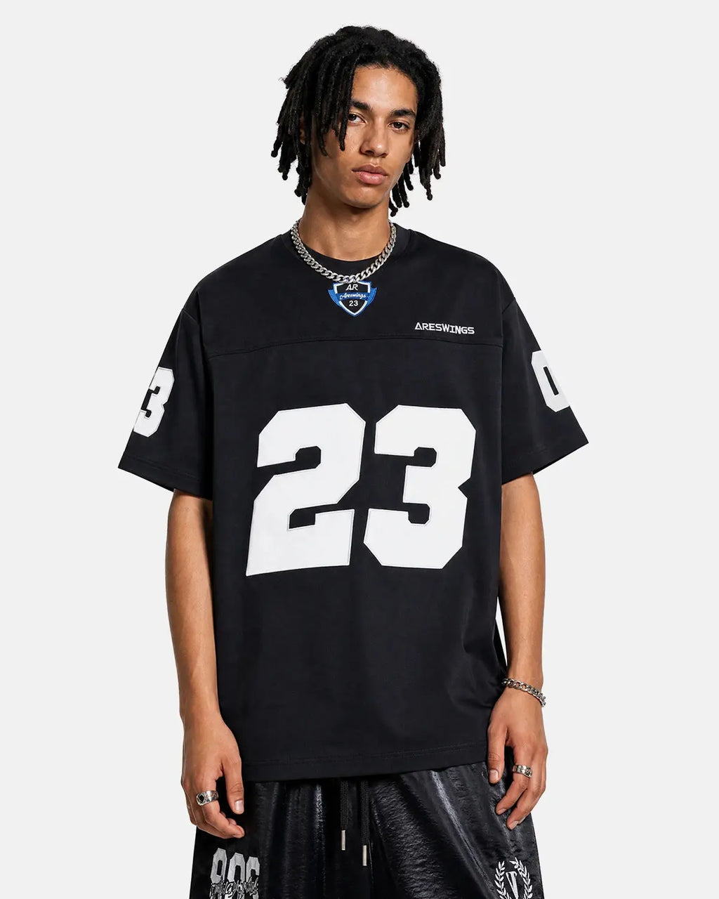 Black varsity number applique T-shirt by Flation Streetwear, featuring bold stitched number detail on the front.
