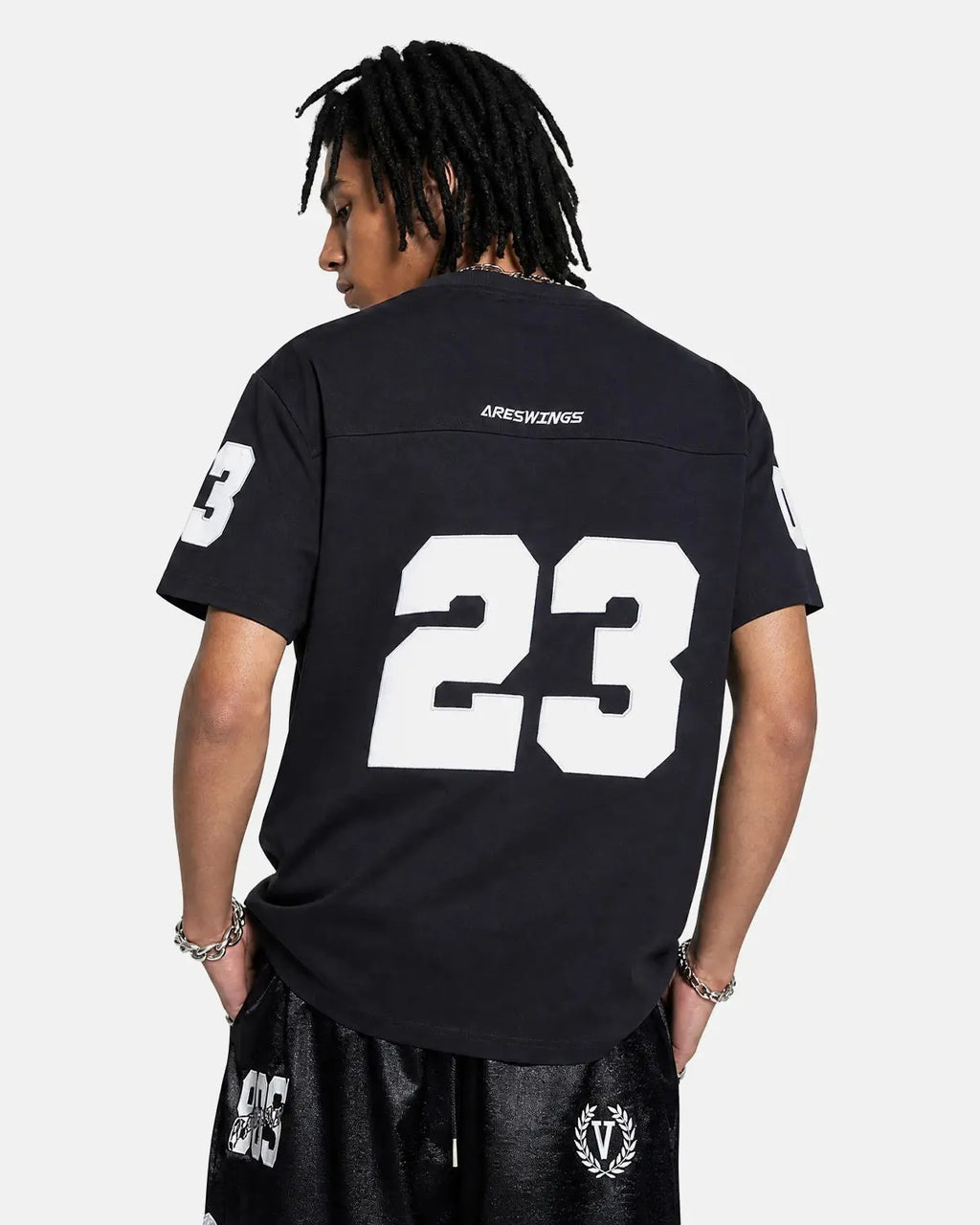 Black varsity number applique T-shirt by Flation Streetwear, featuring bold embroidered number on front.