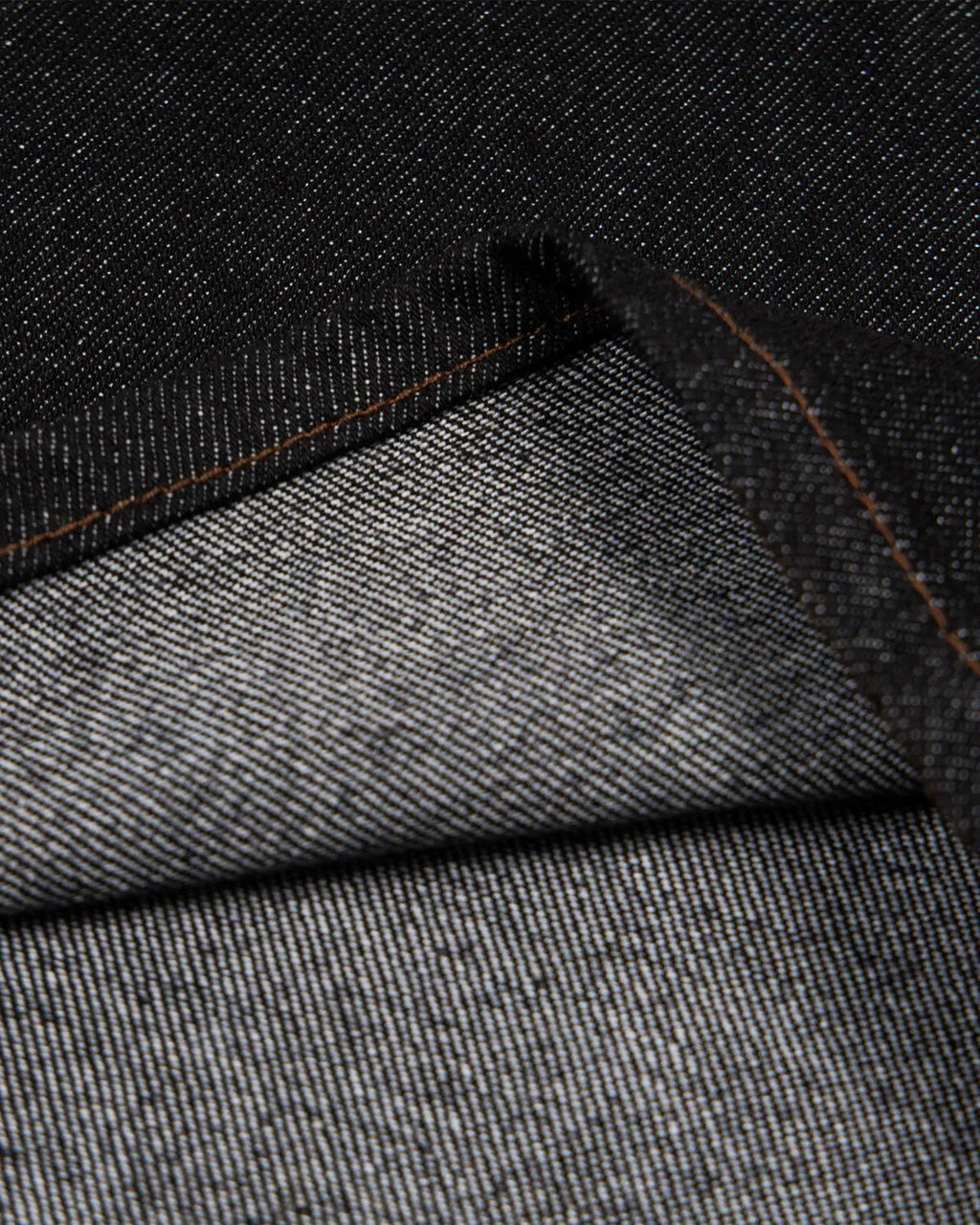 Black asymmetric buckle raw baggy jeans by Flation Streetwear, featuring a relaxed fit and distinctive design details.