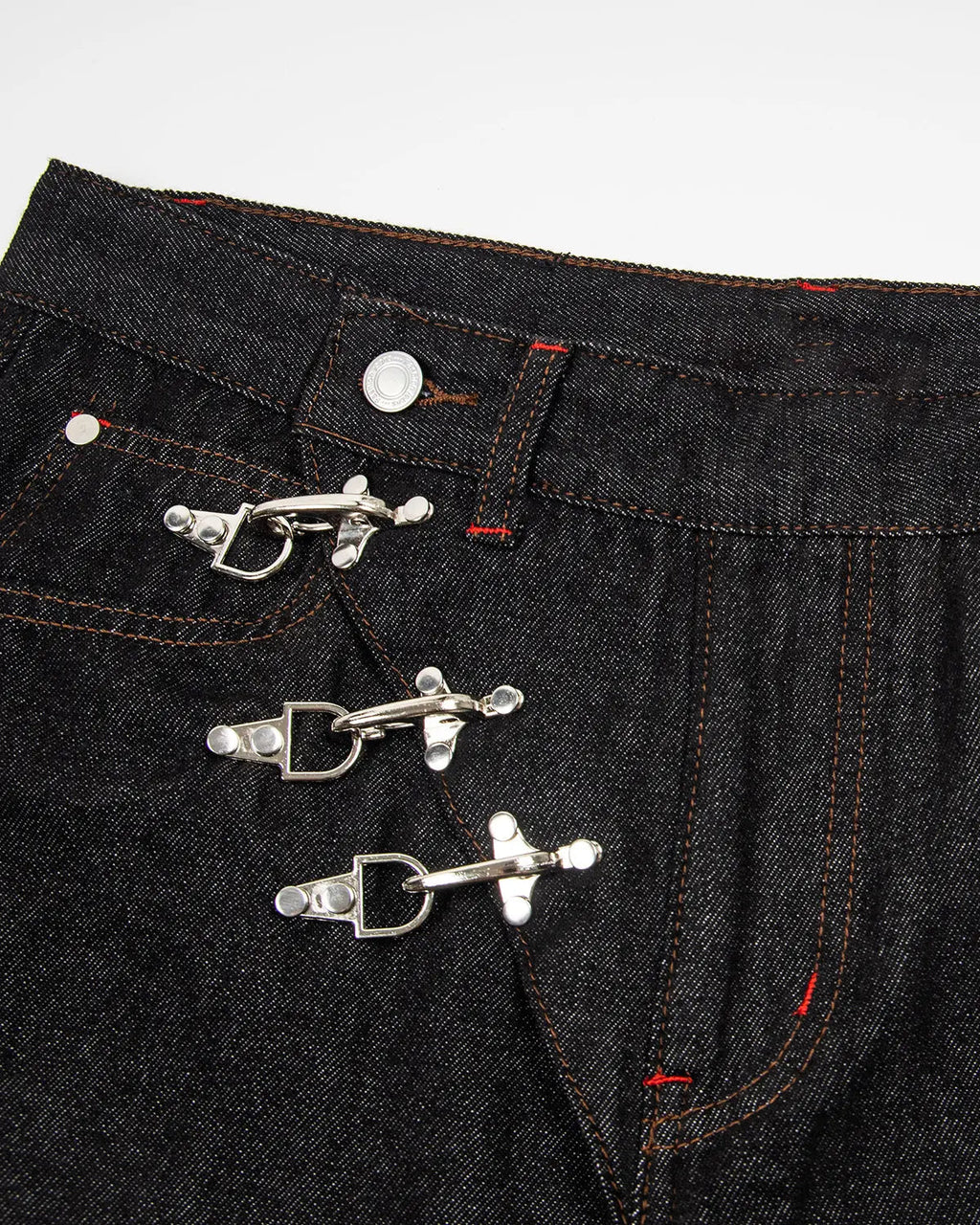 Black asymmetric buckle raw baggy jeans by Flation Streetwear, featuring relaxed fit and unique buckle details.