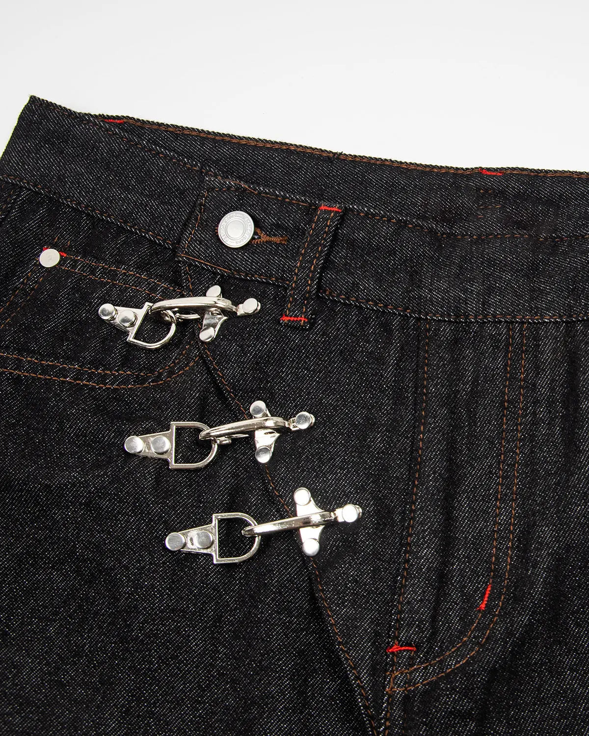 Black asymmetric buckle raw baggy jeans by Flation Streetwear, featuring relaxed fit and unique buckle details.