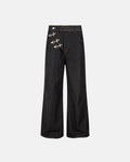 Black asymmetric buckle raw baggy jeans from Flation streetwear with loose fit and distressed details.