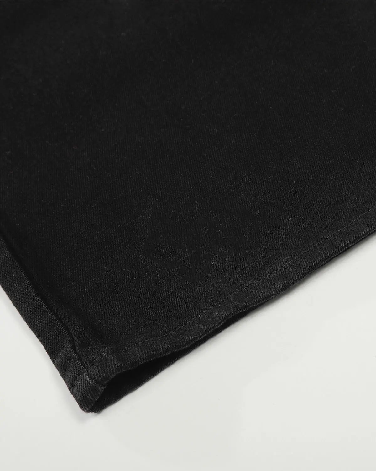 Black baggy jeans by Flation Streetwear featuring relaxed fit and distressed detailing, casual street style for everyday wear.
