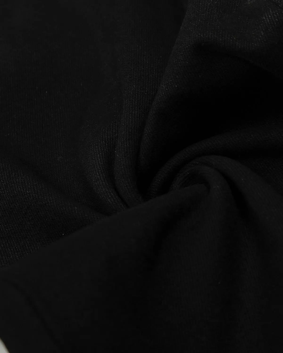 Black baggy jeans by Flation Streetwear with relaxed fit and casual style, displayed on a hanger against a plain background.