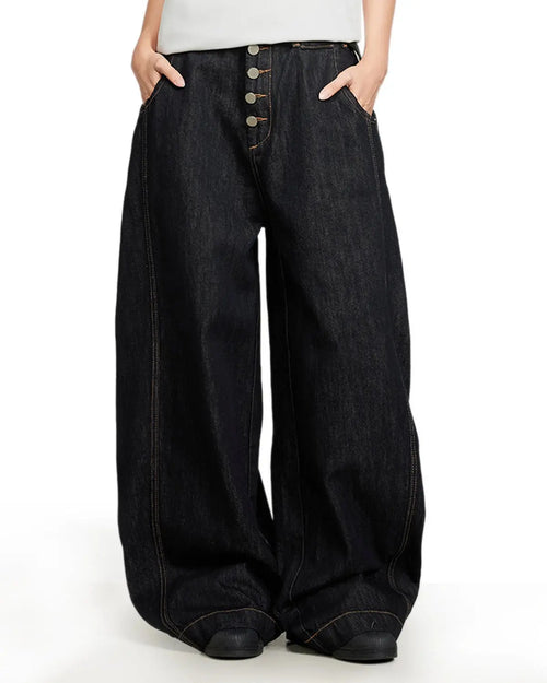 Black buttons-up barrel baggy jeans by Flation Streetwear, showing relaxed fit with button details and casual street fashion style.