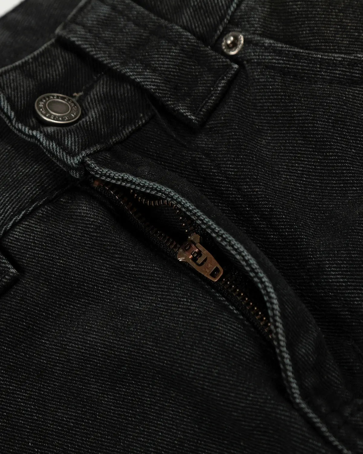 Black patchwork barrel jeans from INFLATION streetwear featuring a relaxed fit and detailed patchwork design.
