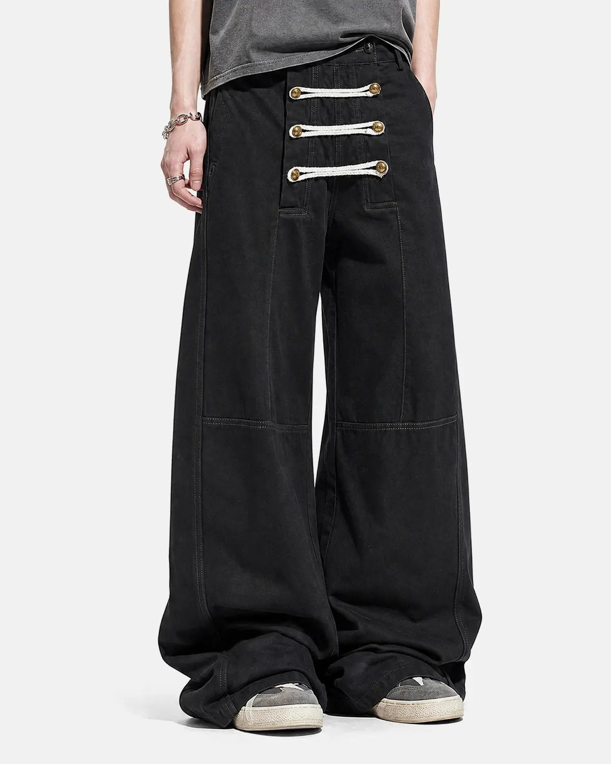 Black braided rope barrel pants by Flation Streetwear featuring a relaxed fit and unique rope detailing.