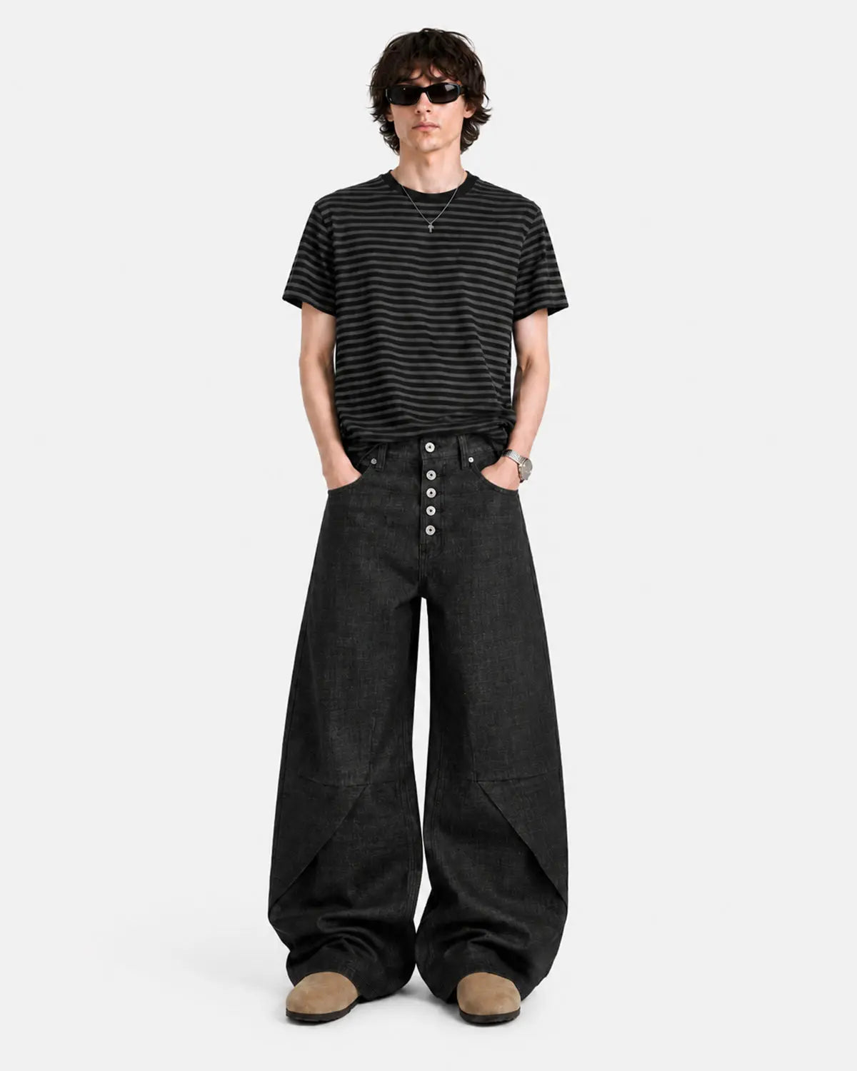 Black Flation streetwear baggy jeans with button details, deconstructed raw style, relaxed fit, and casual streetwear look.