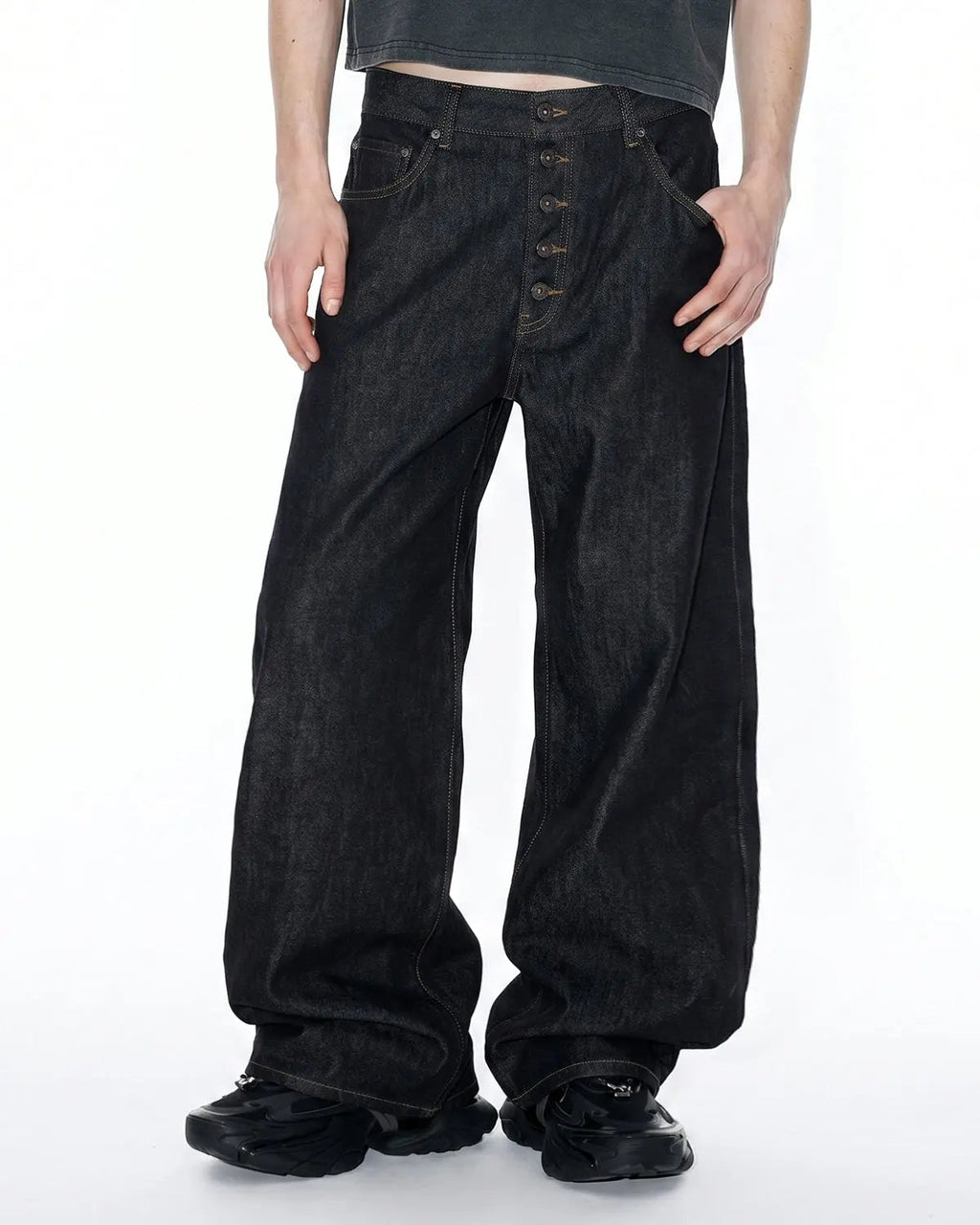 Black Flation Streetwear button fly raw baggy jeans with relaxed fit and rugged denim appearance.