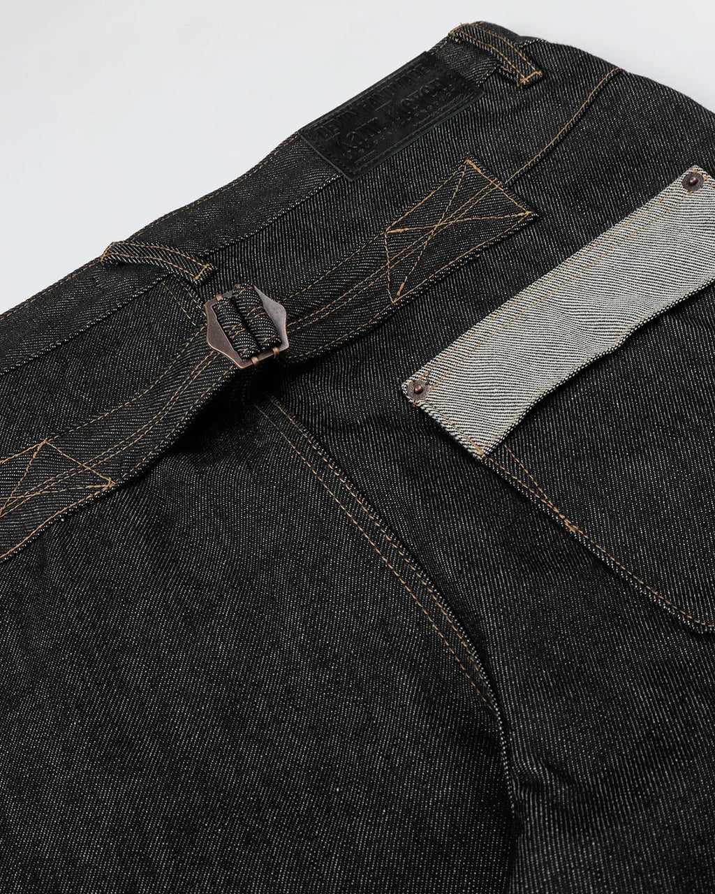 Black button fly raw baggy jeans by Flation Streetwear featuring relaxed fit and distressed denim style.