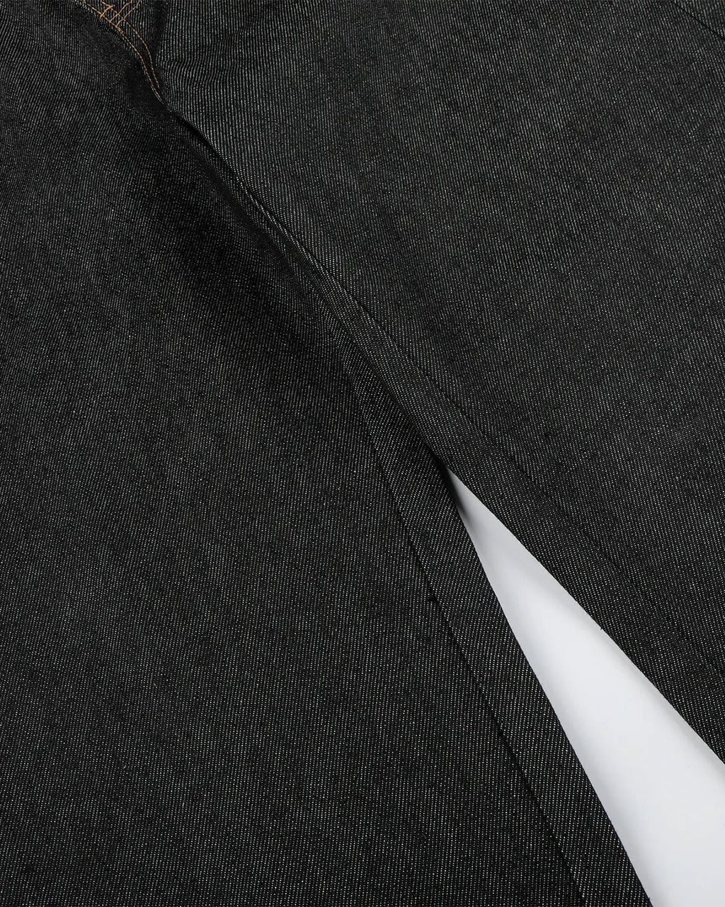 Black Flation streetwear baggy jeans with button fly, featuring a raw, relaxed fit and casual style.