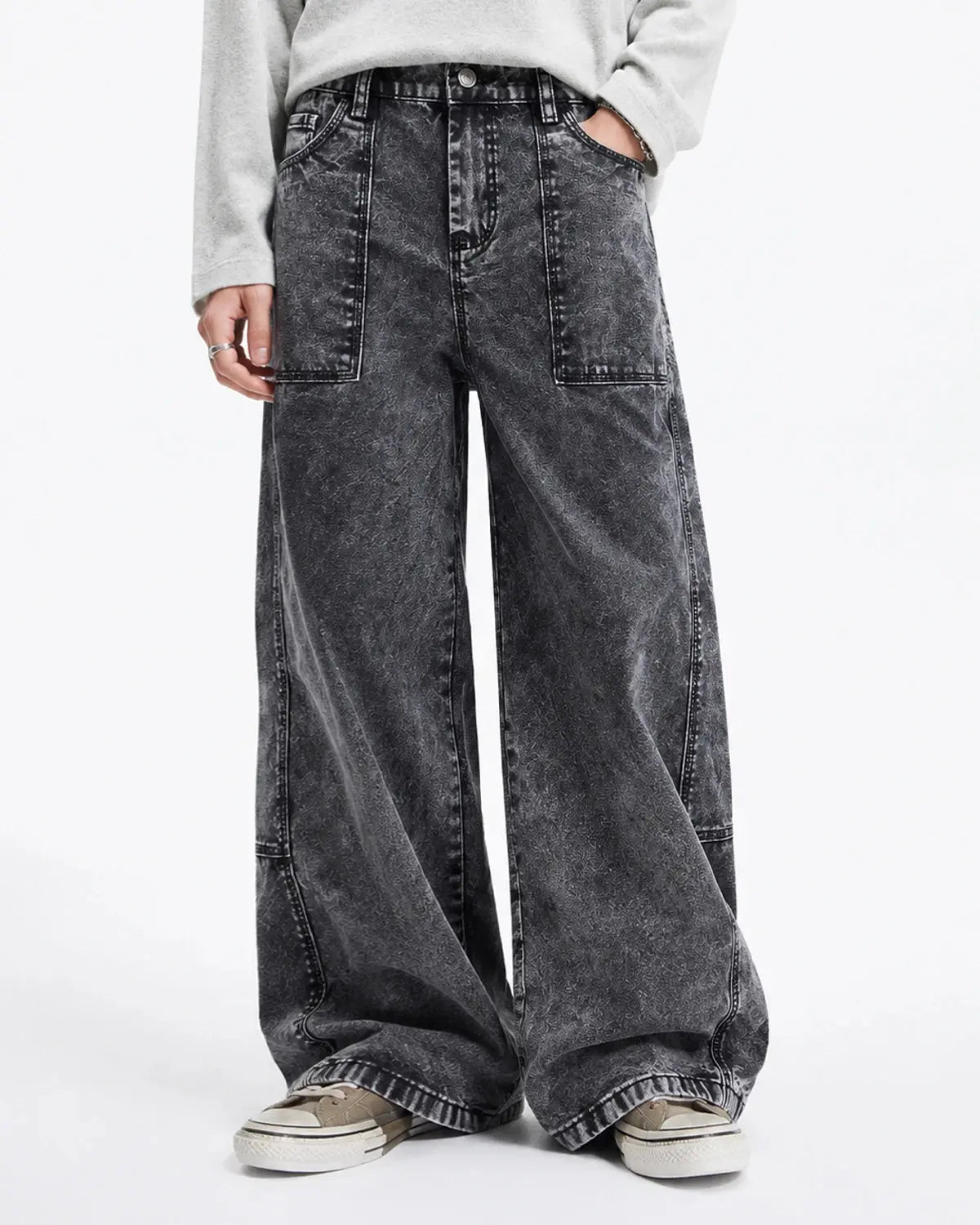 Distressed barrel jeans from Flation Streetwear featuring deconstructed design and ripped details, displayed on a neutral background.