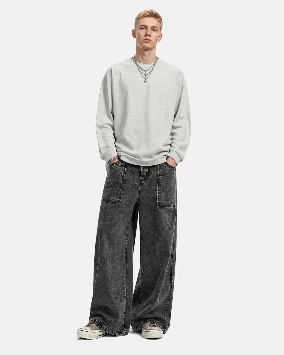 Deconstructed distressed barrel jeans by Flation Streetwear with ripped details and raw hems, showcasing a trendy, edgy denim style.