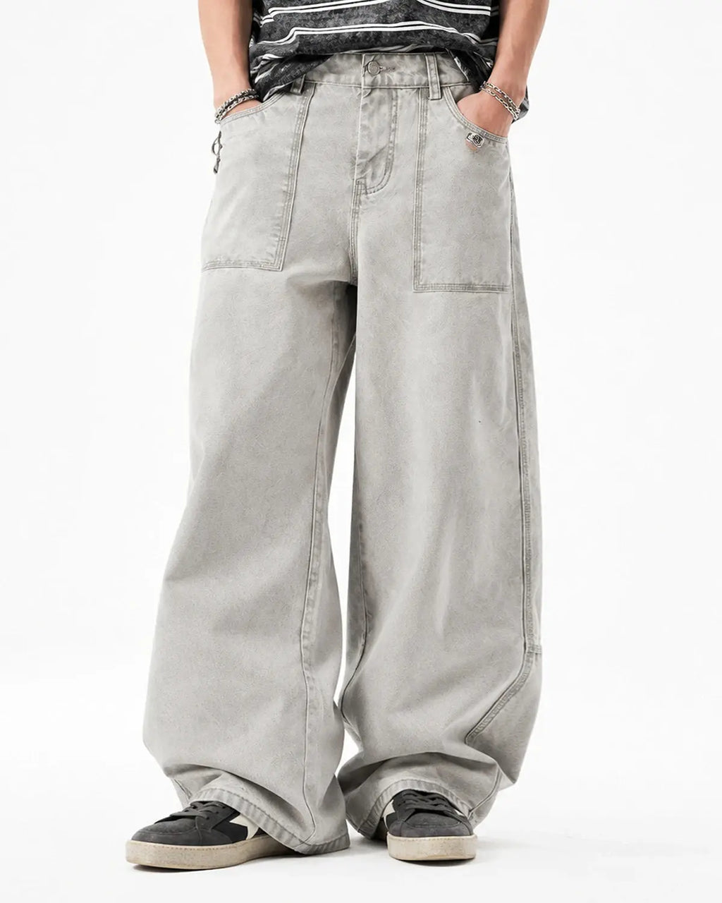 Deconstructed distressed barrel jeans by Flation Streetwear showing ripped details and worn fabric in a casual fit.