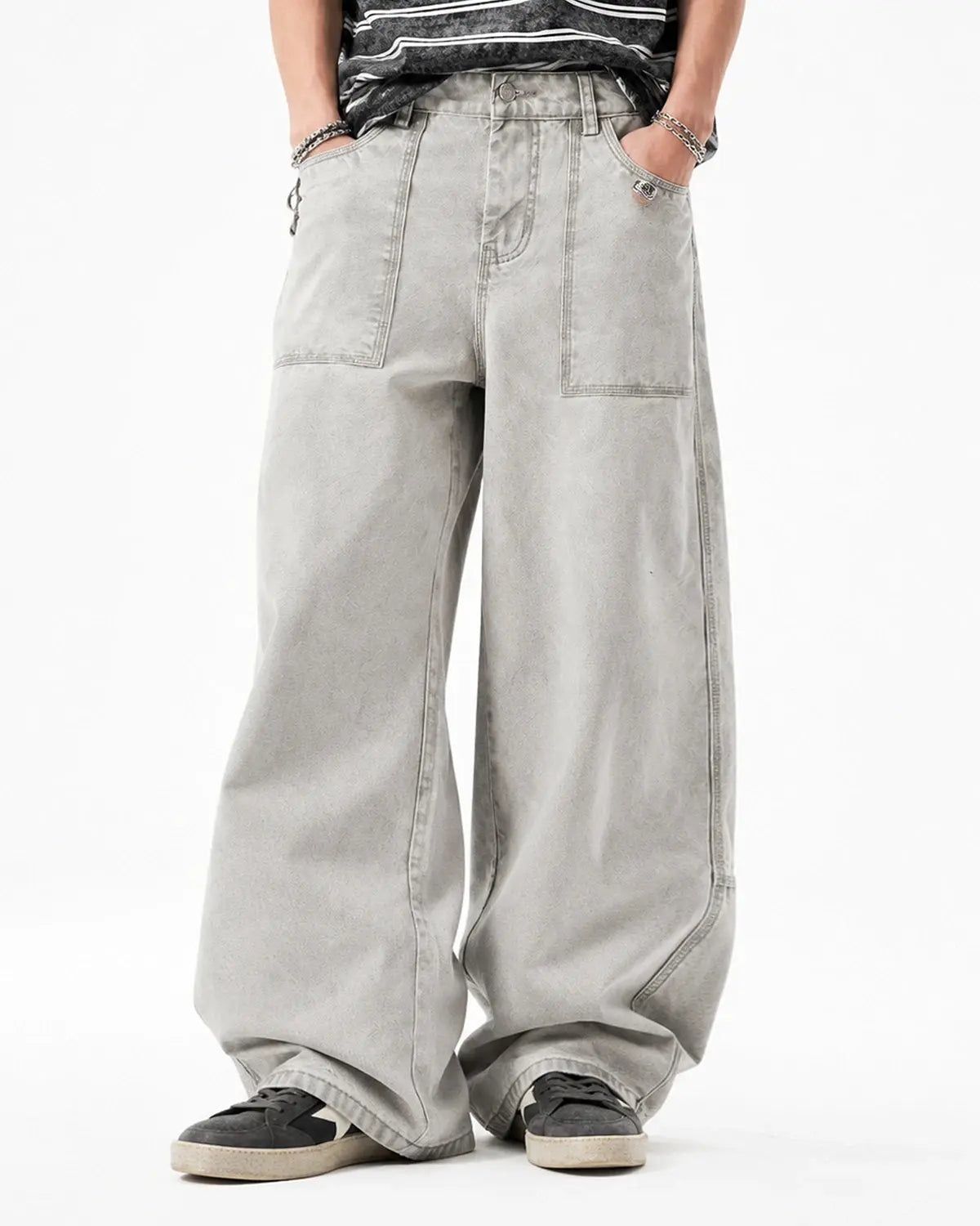 Deconstructed distressed barrel jeans by Flation Streetwear showing ripped details and worn fabric in a casual fit.