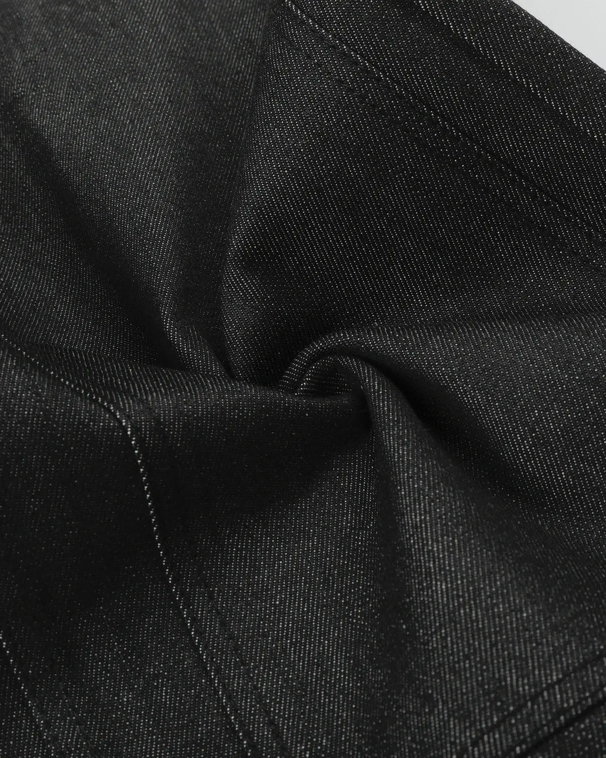 Black deconstructed utility baggy jeans by Flation Streetwear featuring relaxed fit and multiple utility pockets.