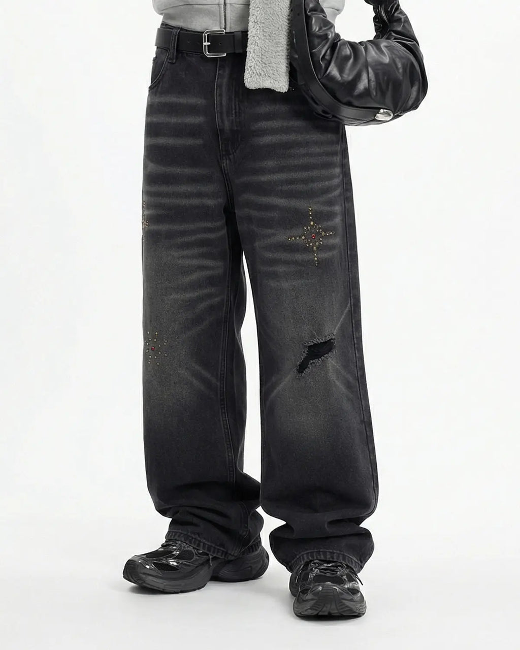 Distressed rhinestone ripped baggy jeans by Flation streetwear, featuring ripped details and rhinestone embellishments.