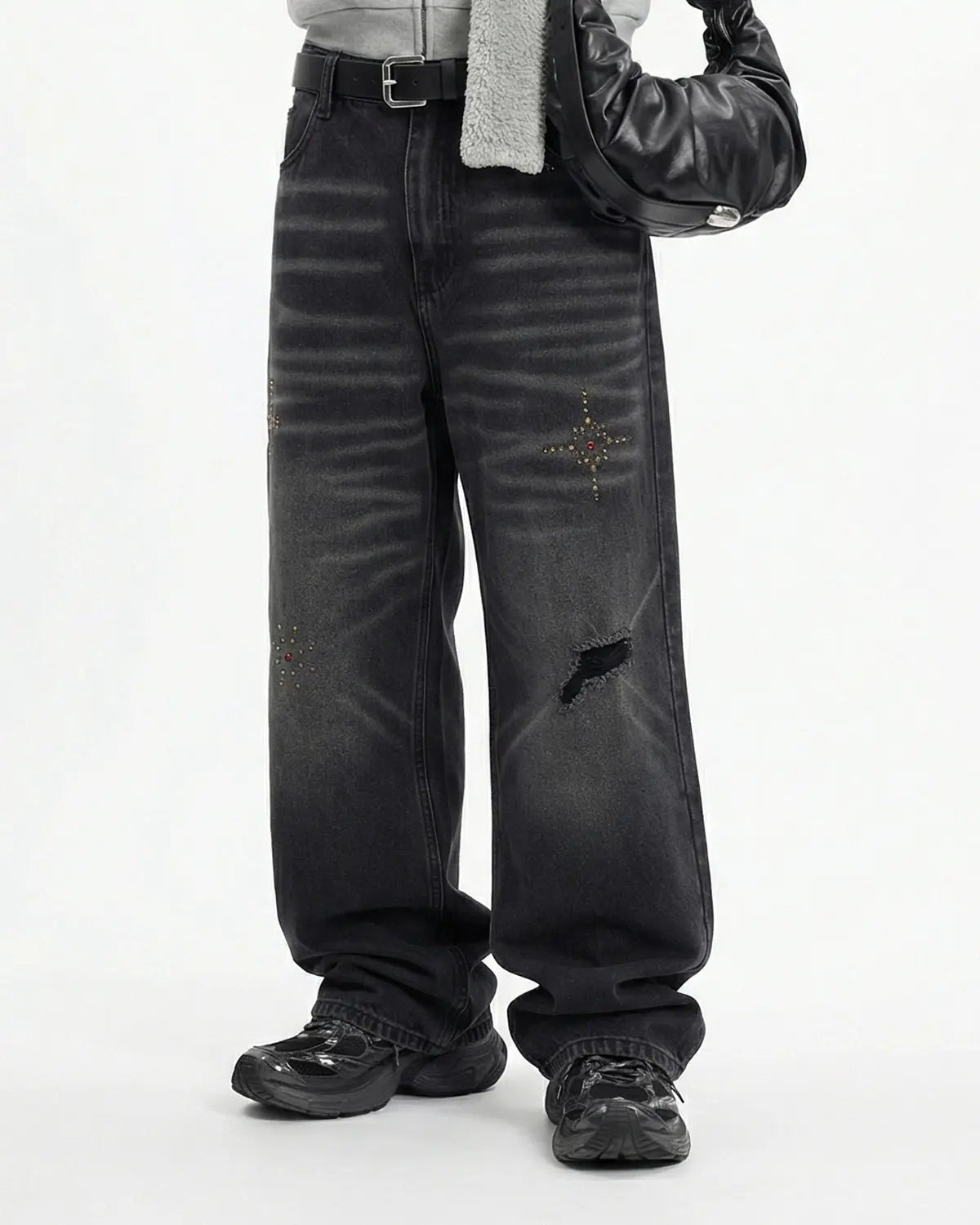 Distressed rhinestone ripped baggy jeans by Flation streetwear, featuring ripped details and rhinestone embellishments.