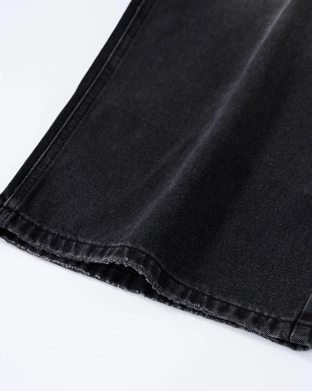 Distressed rhinestone ripped baggy jeans from Flation Streetwear with frayed edges and embellishments, relaxed fit, denim fabric.