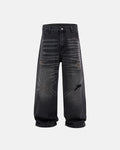 Distressed rhinestone ripped baggy jeans by Flation Streetwear with frayed edges and embellishments, showcasing a casual, edgy style.