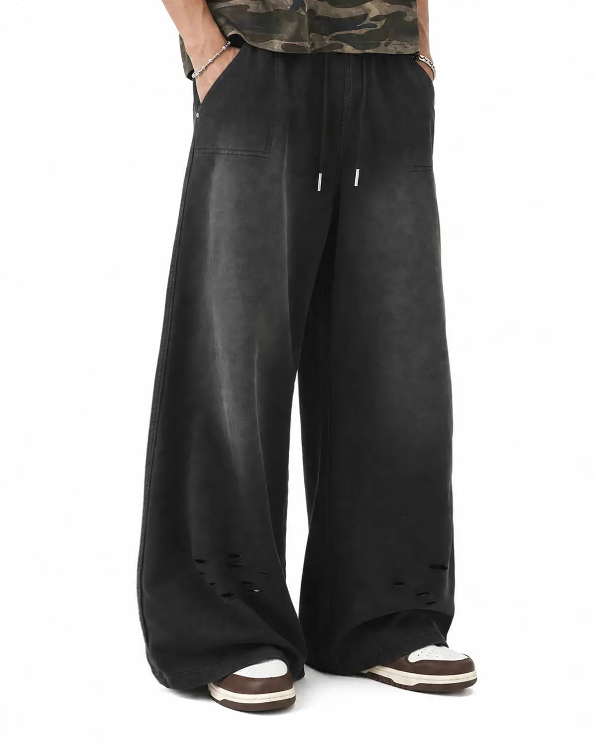 Black distressed washed baggy sweatpants by Flation Streetwear, featuring a relaxed fit and casual style.