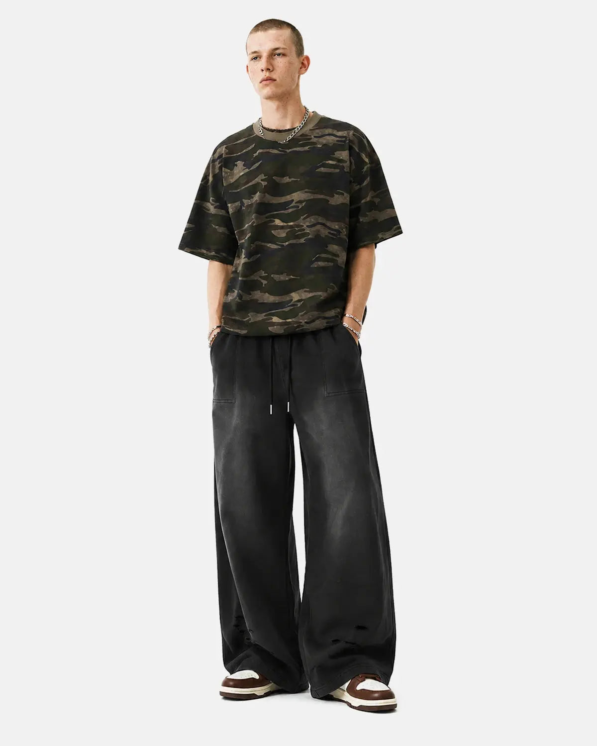 Black distressed washed baggy sweatpants by Flation Streetwear, relaxed fit with a faded, vintage look and casual style.