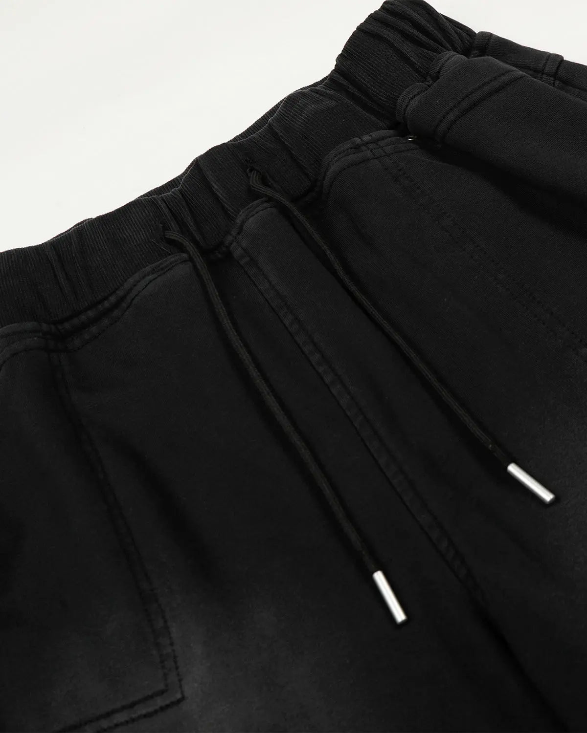 Black distressed washed baggy sweatpants by Flation Streetwear, featuring a relaxed fit and casual street style.