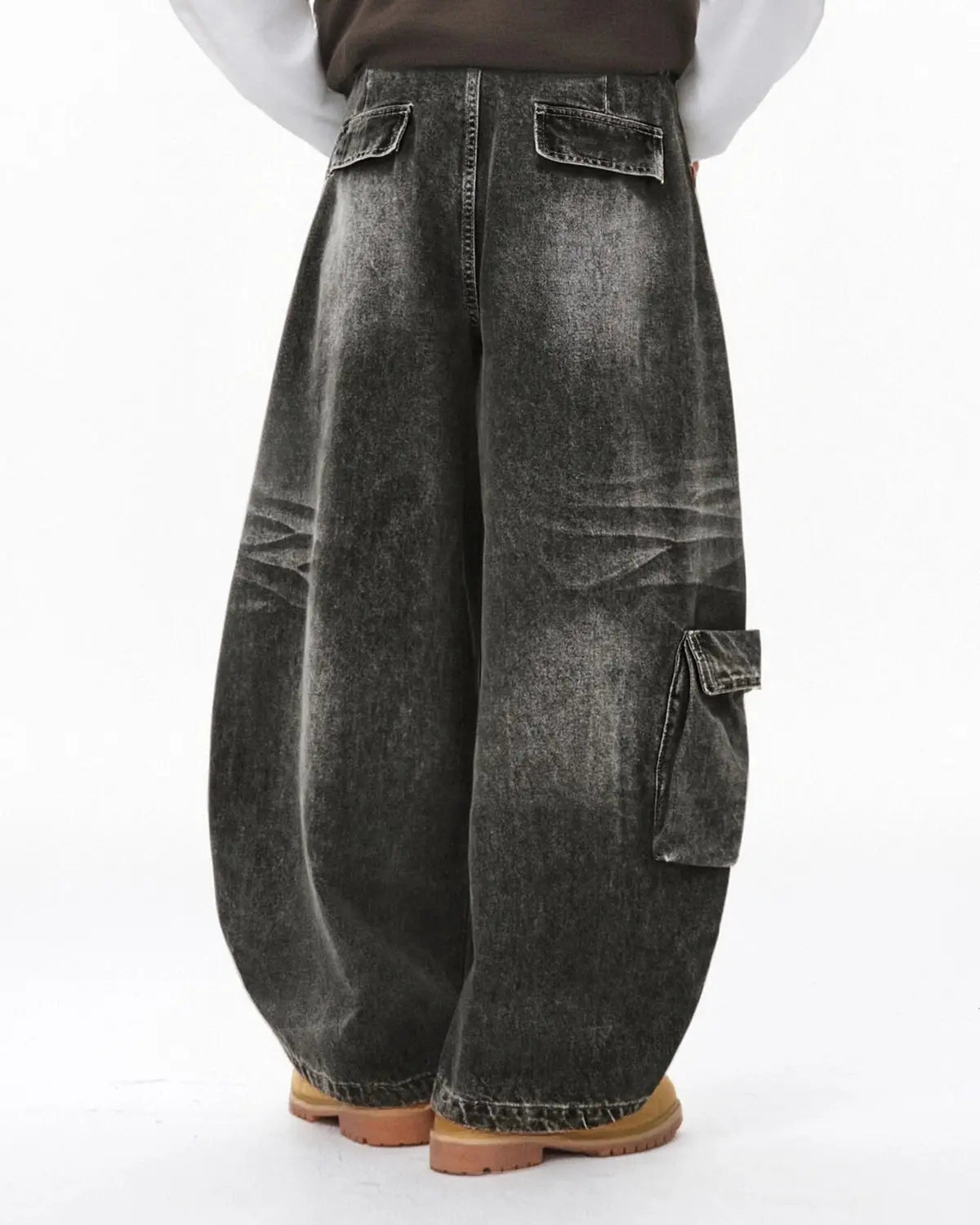 Black distressed washed cargo barrel jeans by Flation Streetwear, featuring a relaxed fit and rugged, stylish design.